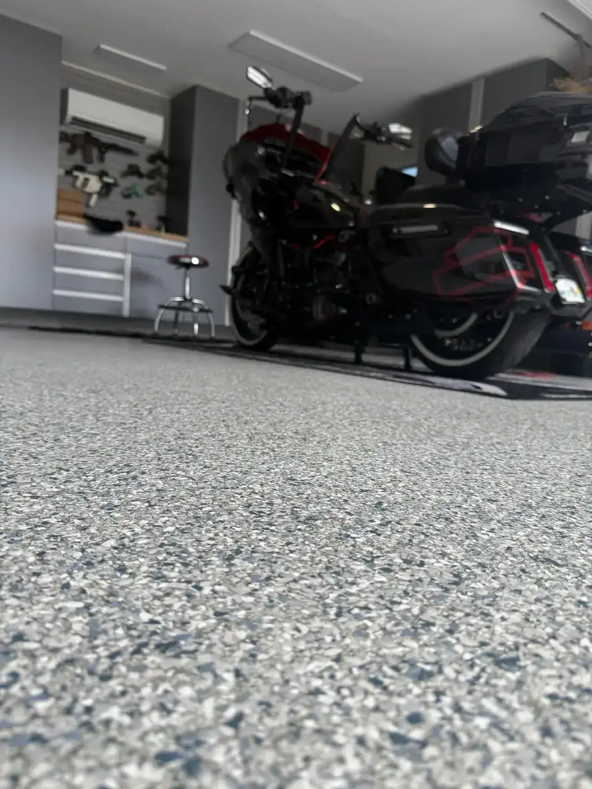 Gray flake floor in a residential garage with a motorcycle, Sunrise FL