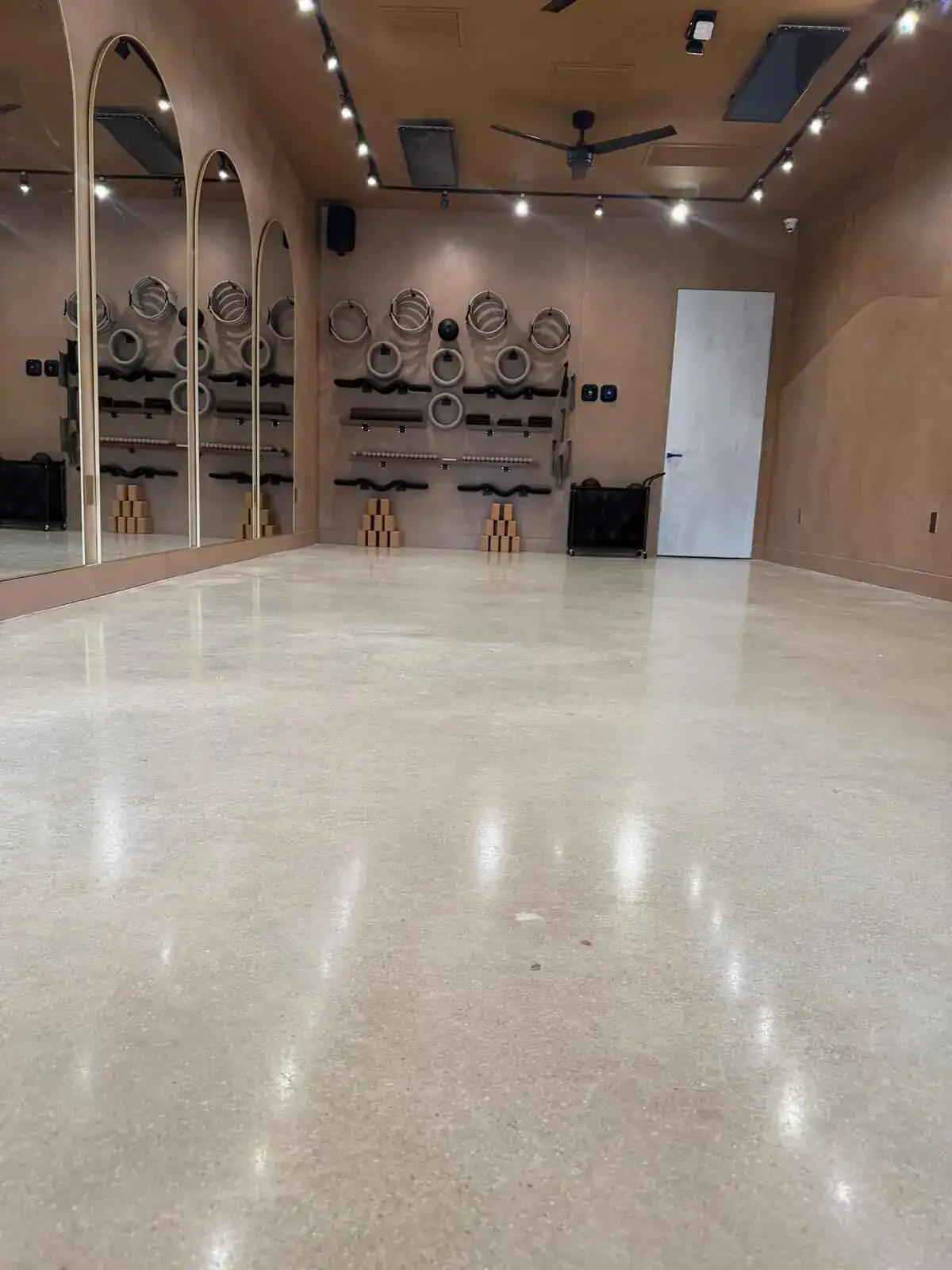 Studio with cream polished concrete and a mirror finish, South Florida